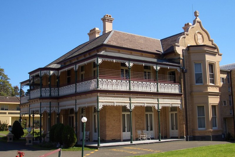 Dappeto, a Federation house with tall brick chimneys and half-timbered gables, Arncliffe