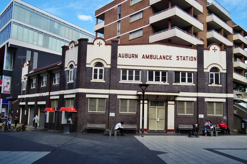 The 1930 Auburn Ambulance Station on Queen Street, with apartment buildings rising behind it