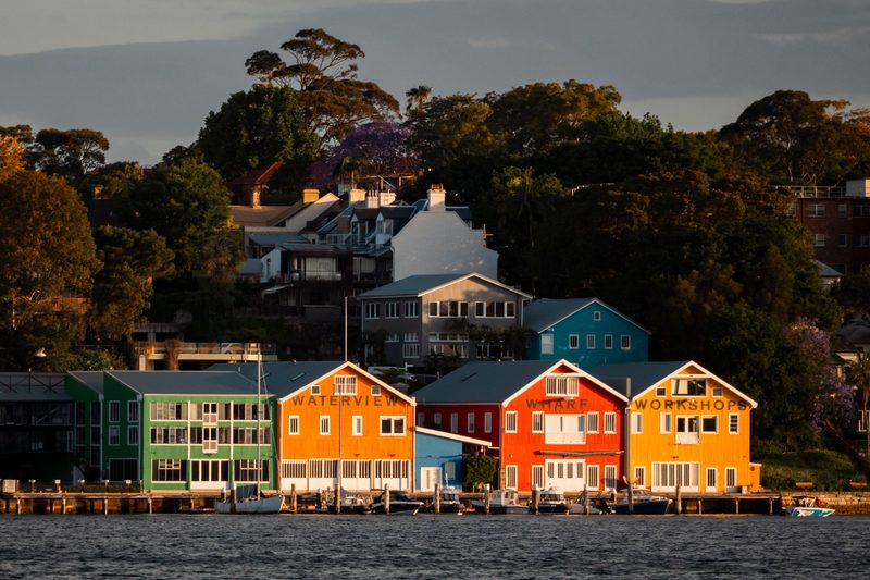 The colourful timber Waterview Wharf Workshops on the Balmain waterfront at sunset