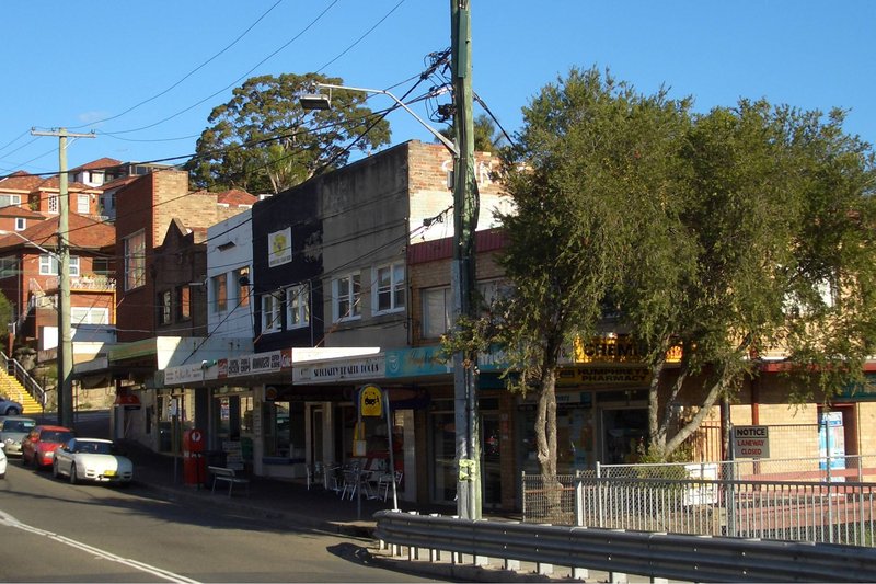 The shops on Hartill-Law Avenue at Bardwell Park, with flats on the rise behind