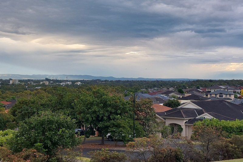 Tiled rooftops of Beaumont Hills with the Blue Mountains on the horizon