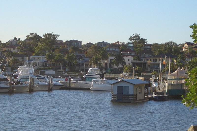 Cruisers berthed at the marina below the hillside homes at Blakehurst