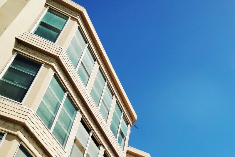 Apartment building façade against a clear sky at Bondi Junction