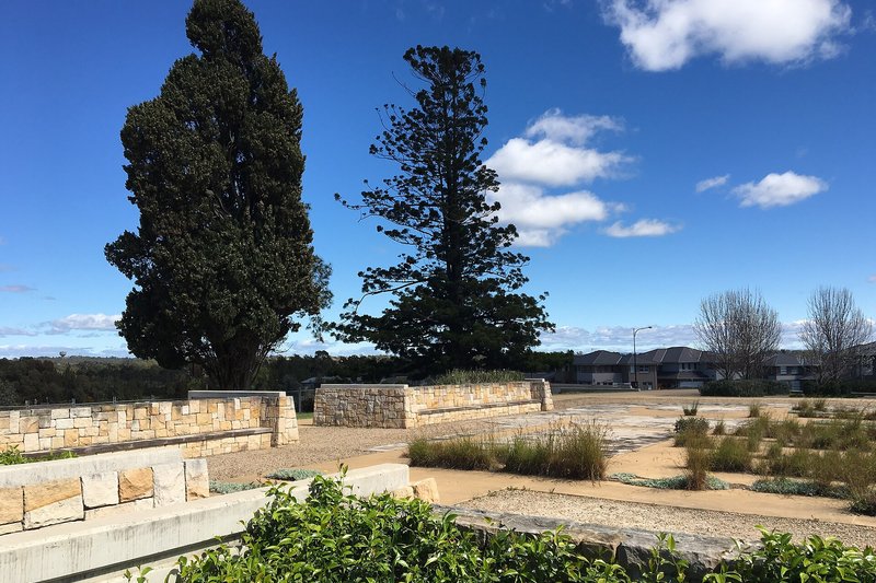 Sandstone terraces marking the site of Bungarribee Homestead, with new homes beyond
