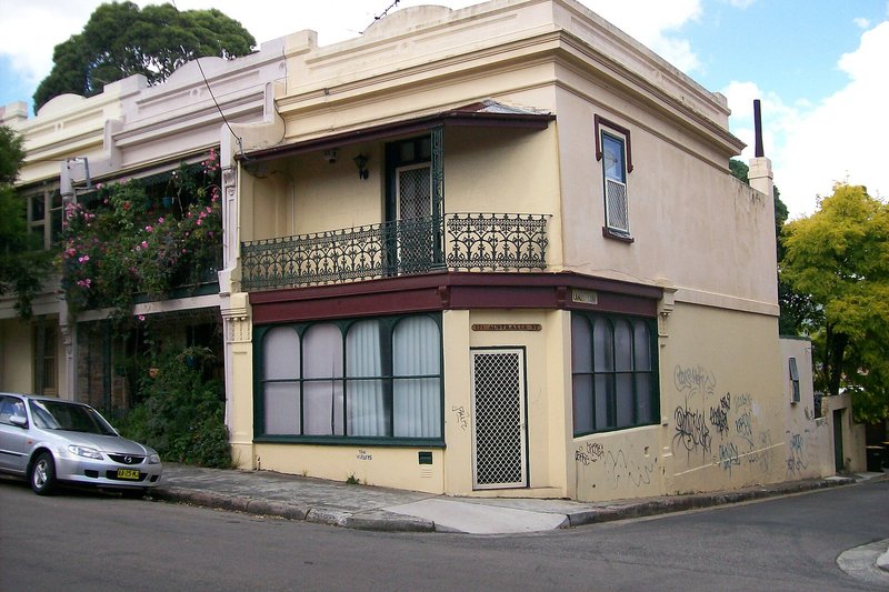 A former corner store with an iron lace balcony, now a house, on Australia Street in Camperdown
