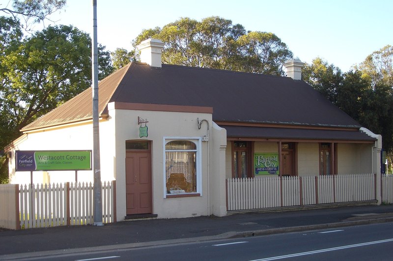 Westacott Cottage at Canley Vale, an early cottage behind a white picket fence