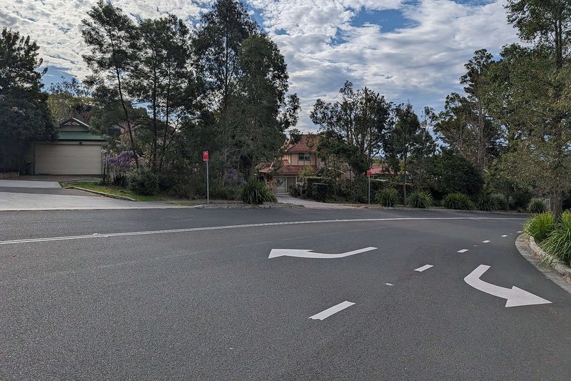 A leafy residential street in Cherrybrook, with houses set back behind established trees