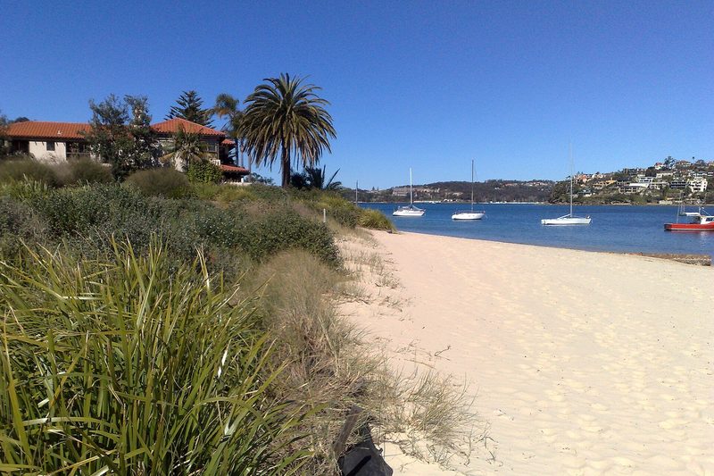 Clontarf Beach on Middle Harbour, with sailboats moored offshore
