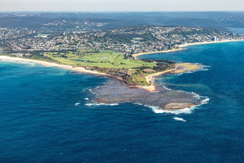 Long Reef headland and golf links, with the beach curving north towards Collaroy