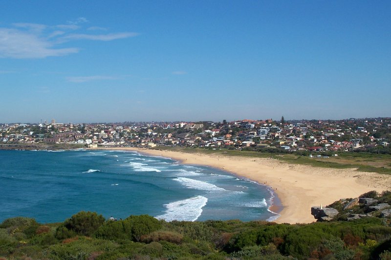 Curl Curl beach curving south towards the rooftops of Freshwater