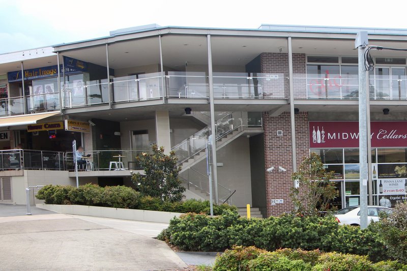 The Midway shops at Denistone East, a two storey strip with cafes and a cellars