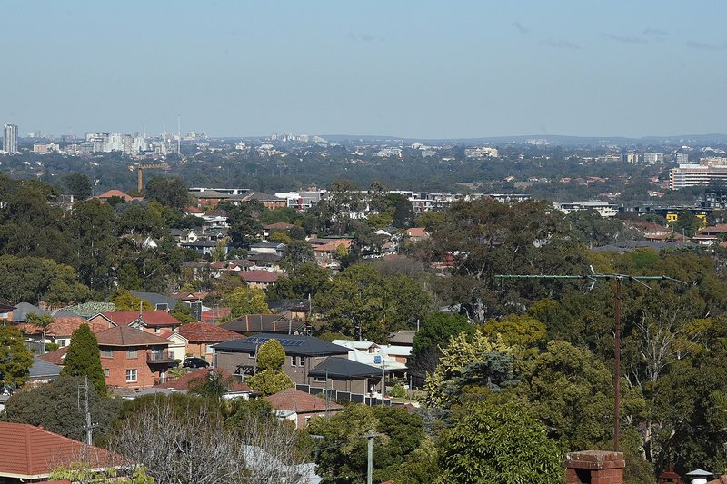 The view from Denistone across tiled rooftops and gardens towards Parramatta