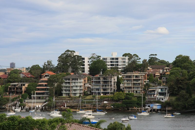 Apartment blocks above the water at Drummoyne, with yachts moored below