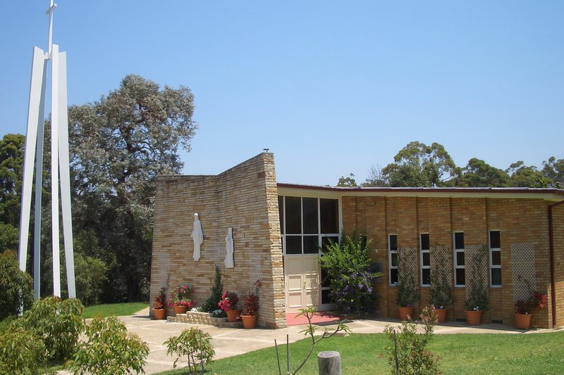 St Bernadette's, a mid-century brick church with a freestanding bell frame, Dundas Valley