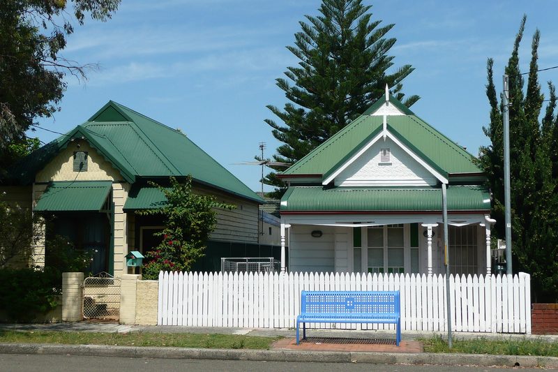 Federation cottages with picket fences on a street in Eastlakes
