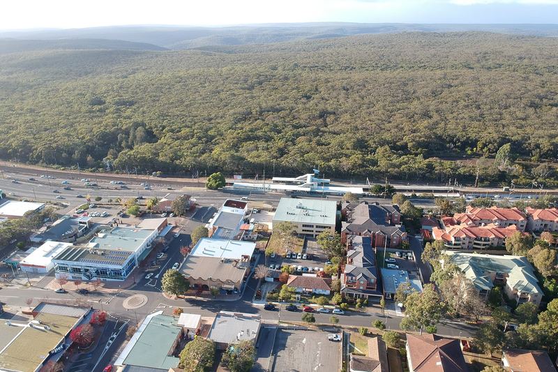 Aerial view of the Engadine town centre and station with the Royal National Park beyond