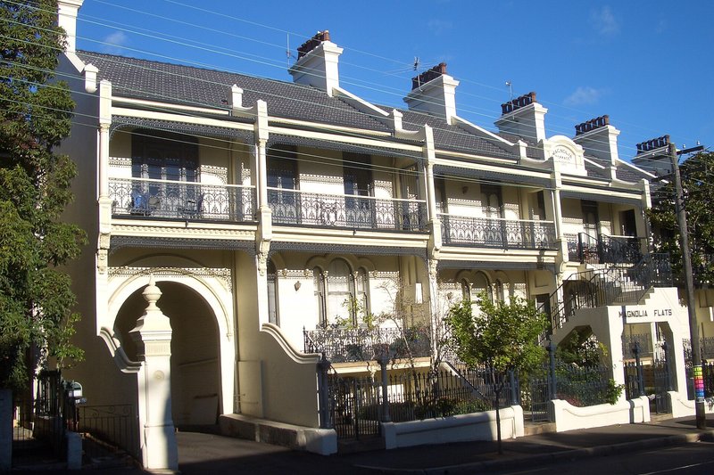 A row of Victorian terraces with iron lacework balconies on Pyrmont Bridge Road, Forest Lodge