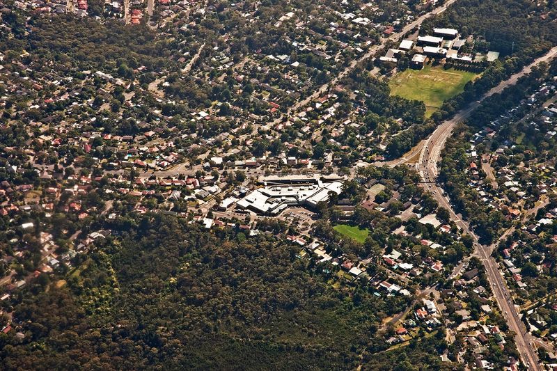 Frenchs Forest from the air, houses and bushland either side of Warringah Road