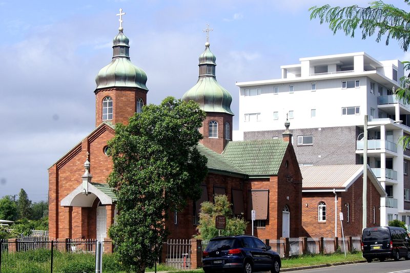 St Aphanasius Ukrainian Orthodox Church in Granville, with apartment buildings rising behind it