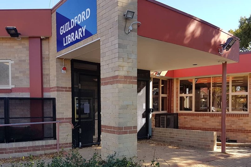 Guildford Library on Railway Terrace, a low brick building with a covered entrance