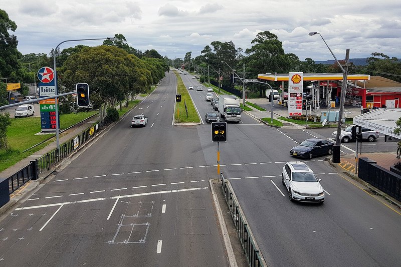 The Princes Highway running through Heathcote with bushland ridges beyond