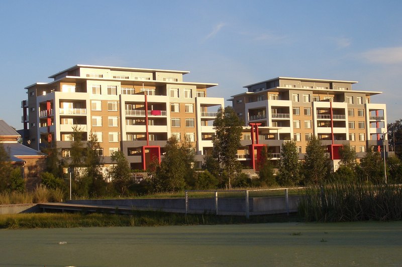 The Brickworks apartment buildings at Holroyd, above the water of the old clay pit