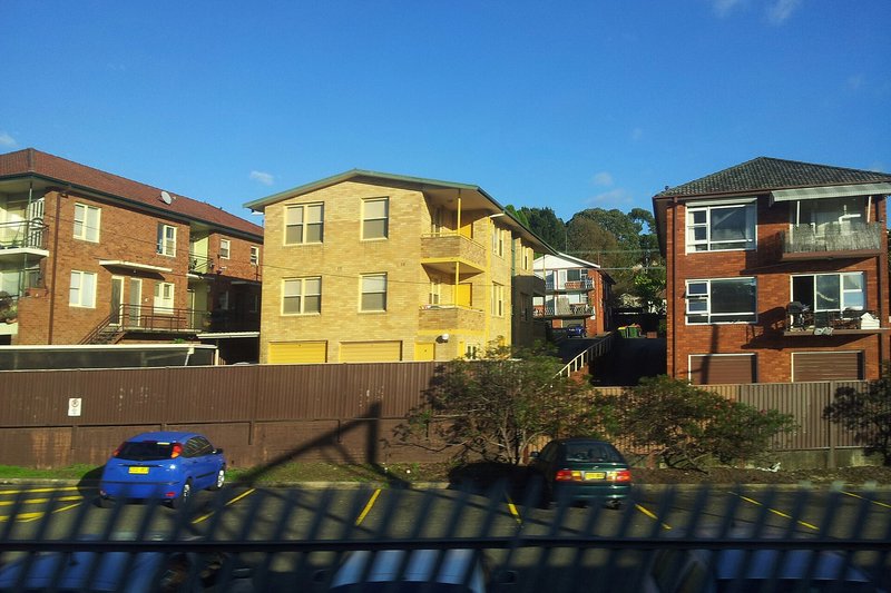 Brick home unit blocks on a rise above the railway line at Jannali