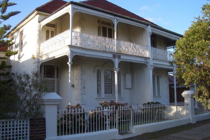 A two storey house with iron lace balconies on Victor Street, Kogarah