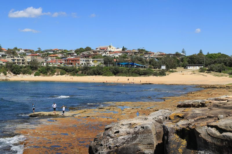 Long Bay beach at Malabar, with the suburb on the headland above