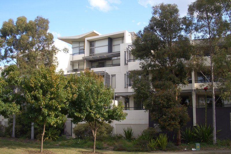 Apartments and townhouses among young gums in the former athletes village at Newington