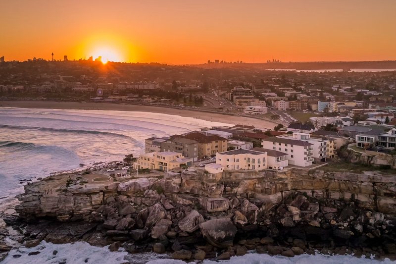 Sunset over North Bondi, looking along the beach from the headland