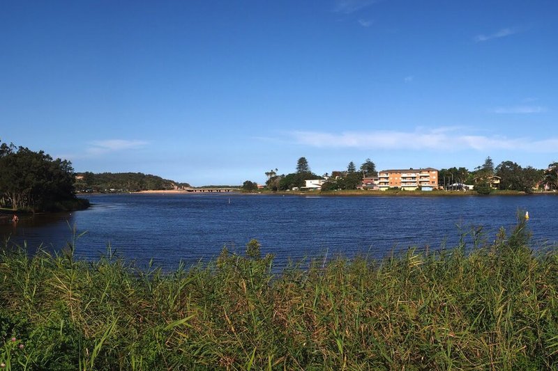 Narrabeen Lagoon looking towards the entrance, with units and houses along the far bank at North Narrabeen