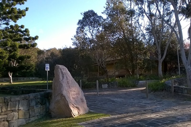 The sandstone marker and gums at Peace Park, Oxford Falls