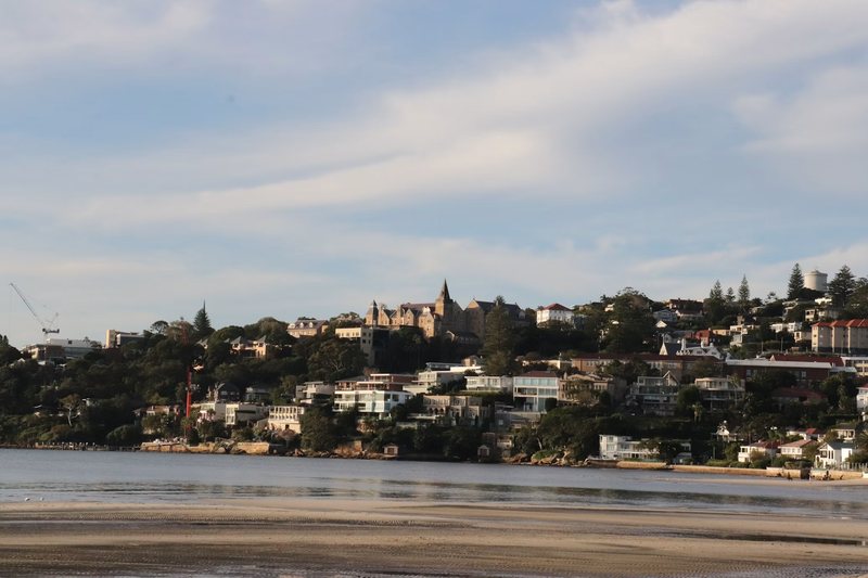 Houses rising above the water on the Rose Bay foreshore