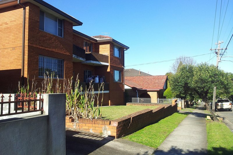 Red brick flats and houses on a residential street in Roselands
