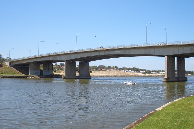 Silverwater Bridge crossing the Parramatta River, with housing along the far bank