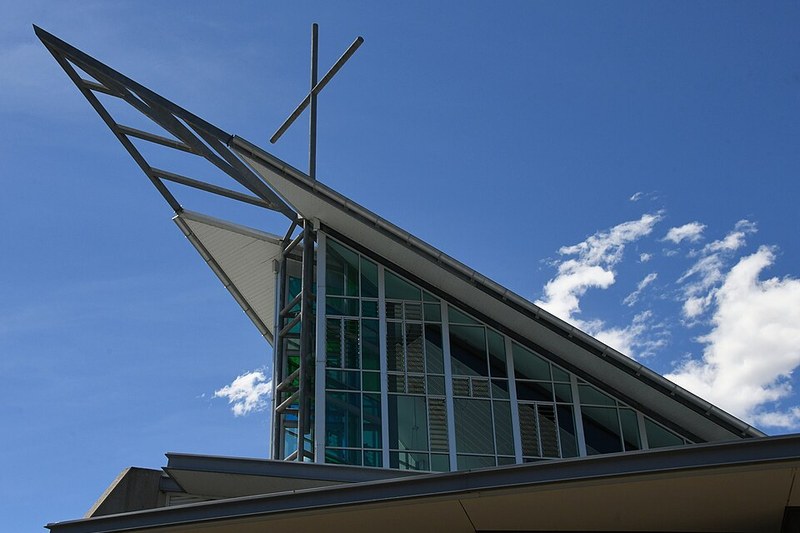 The angular roofline and glazed gable of St John XXIII Catholic Church, Stanhope Gardens