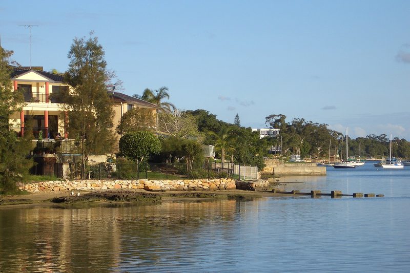 Waterfront homes and moored boats on the Parramatta River at Tennyson Point