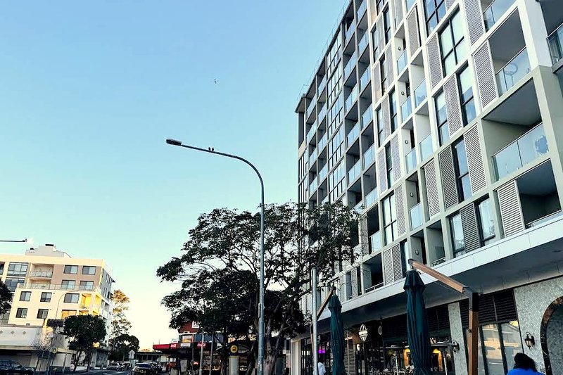 Apartments and shopfronts along Villawood Place