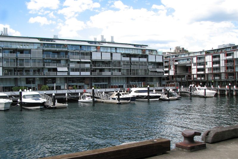 Converted wharf apartments and moored boats at the Walsh Bay wharves