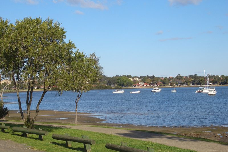 Boats moored on Hen and Chicken Bay, seen from the foreshore at Wareemba