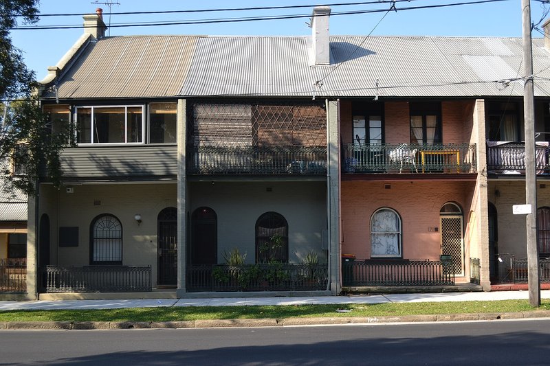 A row of two storey terrace houses with iron lace balconies in Waterloo