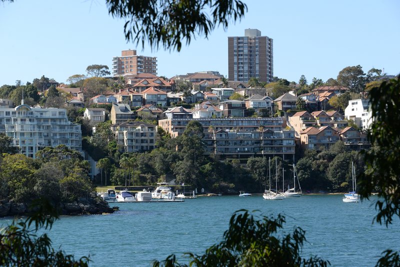 Houses and apartments stepping up the slope at Waverton, above a boat mooring