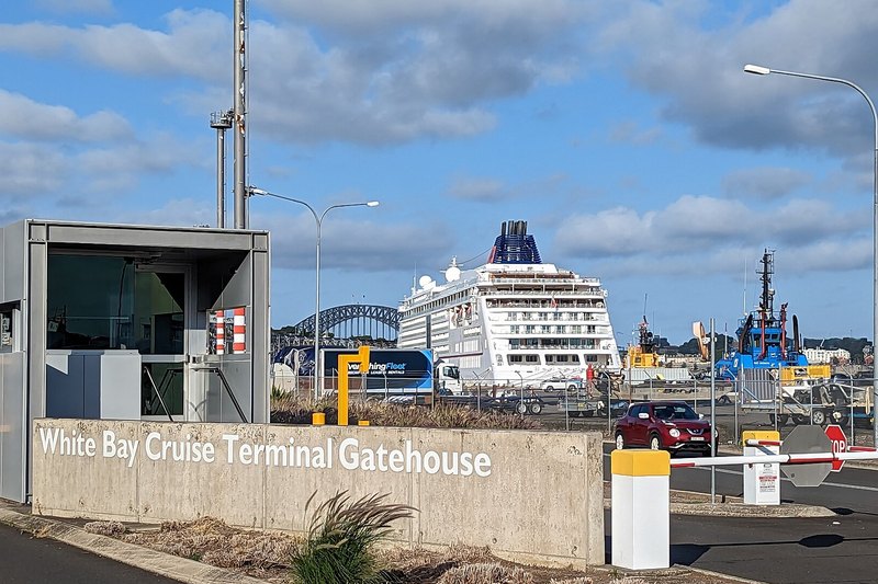 The White Bay Cruise Terminal gatehouse, with a cruise ship berthed and the Harbour Bridge beyond