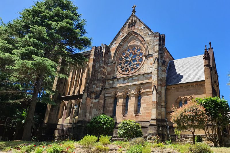 All Saints' Church, Woollahra, a sandstone Gothic Revival church with a rose window